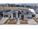 Stunning contemporary home with stone accents, modern architecture, and landscaped front yard at 7125 Skygazer St, Castle Pines, CO 80108