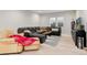 Spacious living room featuring a large leather sectional and modern decor at 7125 Skygazer St, Castle Pines, CO 80108