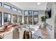 Bright and airy living room with large windows, a fireplace, and comfortable seating at 7125 Skygazer St, Castle Pines, CO 80108