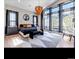 Luxurious bedroom with a large window offering scenic views and modern lighting at 7125 Skygazer St, Castle Pines, CO 80108