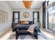 Inviting main bedroom with large windows and a stylish chandelier at 7125 Skygazer St, Castle Pines, CO 80108