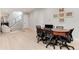 Open office space with a large table and staircase with glass panels at 7125 Skygazer St, Castle Pines, CO 80108