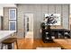 Stylish entryway with display of art on the wall leading to an open doorway at 1452 S Logan St, Denver, CO 80210
