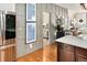 Stylish entryway with stainless steel refrigerator and view to bedroom at 1452 S Logan St, Denver, CO 80210