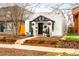 Quaint home exterior featuring a well-kept yard, mature trees, and inviting entrance at 1452 S Logan St, Denver, CO 80210