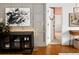 Stylish hallway featuring modern decor, hardwood floors, and a view into another room at 1452 S Logan St, Denver, CO 80210
