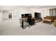 Cozy living room with office setup, modern TV console, and comfortable seating at 1452 S Logan St, Denver, CO 80210