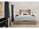 Tranquil bedroom showcases a tufted headboard, soft lighting, and calming color palette at 1452 S Logan St, Denver, CO 80210