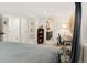 Spacious bedroom with a desk area and a glimpse into a well-appointed ensuite bathroom at 1452 S Logan St, Denver, CO 80210
