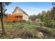 Lovely backyard with lush greenery and a deck, offering privacy and outdoor enjoyment at 31551 Black Widow Dr, Conifer, CO 80433
