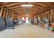 Barn interior featuring exposed wood framework and ample space for storage or workshop at 31551 Black Widow Dr, Conifer, CO 80433