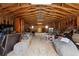 Barn interior featuring exposed wood framework and ample space for storage or workshop at 31551 Black Widow Dr, Conifer, CO 80433