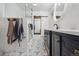 Modern bathroom with stylish blue and white patterned tile floors, sleek vanity, and glass shower at 31551 Black Widow Dr, Conifer, CO 80433