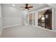 Bonus room with neutral carpet and glass doors overlooking the rest of the house at 31551 Black Widow Dr, Conifer, CO 80433