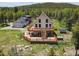 Stunning home featuring a spacious deck, mountain views, and rustic charm at 31551 Black Widow Dr, Conifer, CO 80433