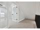 Well-lit hallway with glass doors, neutral carpet and access to other rooms at 31551 Black Widow Dr, Conifer, CO 80433