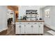 Functional kitchen area with butcher block counters, white cabinets, and modern fixtures at 31551 Black Widow Dr, Conifer, CO 80433