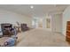Open basement with plenty of room for activities featuring exercise bike and living area at 2868 Breezy Ln, Castle Rock, CO 80109