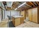 Unfinished basement area with functional work table and storage at 2868 Breezy Ln, Castle Rock, CO 80109