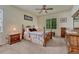 Comfortable bedroom featuring a four-poster bed, ceiling fan, and warm, neutral tones, creating a cozy and inviting space at 2868 Breezy Ln, Castle Rock, CO 80109