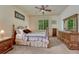 Bedroom with natural light, ceiling fan, and wooden furniture creating a relaxing space at 2868 Breezy Ln, Castle Rock, CO 80109