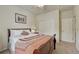 Bright bedroom with a well-lit closet, a large window, and a comfortable bed, all in a clean and organized space at 2868 Breezy Ln, Castle Rock, CO 80109