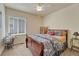 Inviting bedroom featuring a cozy bed and ample natural light creating a serene retreat at 2868 Breezy Ln, Castle Rock, CO 80109