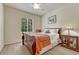 Comfortable bedroom filled with natural light, featuring a patterned blanket, creating a cozy retreat at 2868 Breezy Ln, Castle Rock, CO 80109