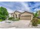 Beautiful home with a spacious driveway and well-kept landscaping, showcasing its inviting facade and curb appeal at 2868 Breezy Ln, Castle Rock, CO 80109