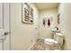 Quaint half-bath with pedestal sink and unique decor touches at 2868 Breezy Ln, Castle Rock, CO 80109