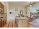 Open kitchen with stainless steel appliances, granite countertops and breakfast bar overlooking the dining area at 2868 Breezy Ln, Castle Rock, CO 80109