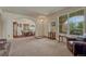 Spacious living room offering an open floorplan with dining room, archways, natural light and neutral colors at 2868 Breezy Ln, Castle Rock, CO 80109