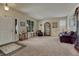 Bright living room with a neutral color scheme, large windows, and comfortable seating arrangements at 2868 Breezy Ln, Castle Rock, CO 80109