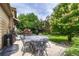 Charming backyard patio with an ornate table and chairs, providing a delightful space for al fresco dining and gatherings at 2868 Breezy Ln, Castle Rock, CO 80109