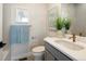 A stylish bathroom features a modern vanity with a large mirror, and refined finishes at 888 S Valentia St # 102, Denver, CO 80247