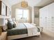 Serene bedroom with a large window, closet and neutral tones for a calming atmosphere at 888 S Valentia St # 102, Denver, CO 80247