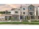Attractive three-story townhomes featuring brick accents, modern design, and individual entrances at 888 S Valentia St # 102, Denver, CO 80247
