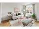 Cozy living room with comfortable seating, stylish decor, and ample natural light at 888 S Valentia St # 102, Denver, CO 80247