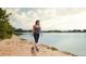 Personal walks dog on the sand along a lake in this scenic and active community at 888 S Valentia St # 102, Denver, CO 80247