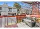 Private back patio with a bench and surrounding greenery at 1475 S Quebec Way # H38, Denver, CO 80231