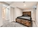 Spacious basement bedroom with a full-size bed and plenty of storage at 1475 S Quebec Way # H38, Denver, CO 80231