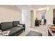 Finished basement with a couch and a workspace at 1475 S Quebec Way # H38, Denver, CO 80231