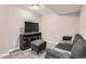Finished basement recreation room features a comfy sofa and TV at 1475 S Quebec Way # H38, Denver, CO 80231
