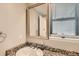 Powder room with granite countertop and framed mirror at 1475 S Quebec Way # H38, Denver, CO 80231