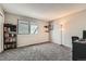 Spacious bedroom with large closet, window, and home office setup at 1475 S Quebec Way # H38, Denver, CO 80231