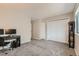 Bright bedroom with built-in shelving and home office area at 1475 S Quebec Way # H38, Denver, CO 80231