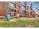 Complex of townhouses with individual back patios at 1475 S Quebec Way # H38, Denver, CO 80231