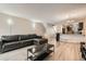 Open living room and kitchen with a view of the kitchen island at 1475 S Quebec Way # H38, Denver, CO 80231