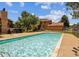 Community pool, set amongst landscaped grounds, offering a refreshing outdoor amenity on a sunny day at 9483 W 89Th Cir, Broomfield, CO 80021