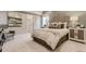 Inviting bedroom features neutral tones, a padded headboard, and minimalist decor at 3341 N Buchanan Way, Aurora, CO 80019